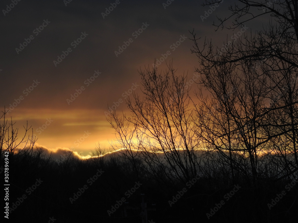 Naklejka premium Sunset in the clouds