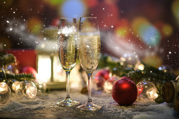 glasses with champagne against the background of New Year's decoration