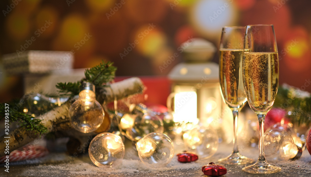 glasses with champagne against the background of New Year's decoration