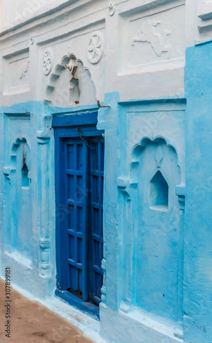 Colorful blue door in the center of Khajuraho, India © venemama