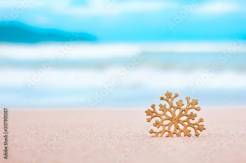 Merry christmas and happy new year. Christmas decorations on the sea sandy beach - winter holidays in the tropics, New Year holiday concept. Copy space