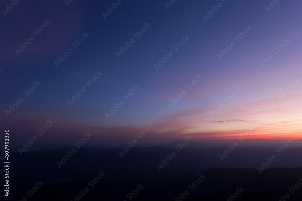 The twilight after sunset in the mountains at Phu-Kradueng in Loei, Thailand. The twilight after sunset in the mountains at Phu-Kradueng in Loei, Thailand.