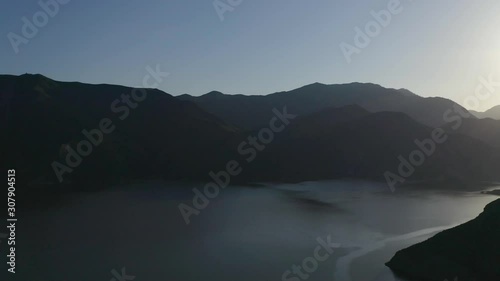 Predawn aerial view of Pyramid Lake, a recreational destination formed by Pyramid Dam on Piru Creek, San Emigdio Mountains, near Castaic, SoCA. West Branch California Aqueduct, State Water Project. photo