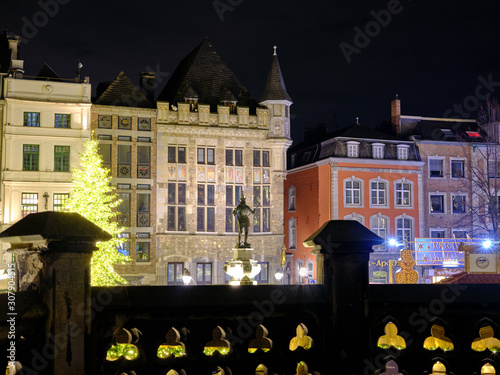 Illuminated Statue of Charlemagne sourrounded by the christmas market, created before 1900, in front of the Town Hall of Aachen, Germany photo