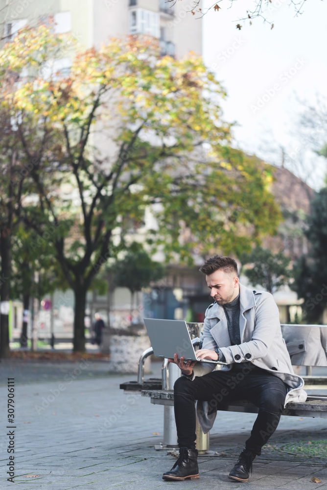 Digital nomad, young computer programmer on business trip with laptop Digital nomad, young computer programmer on business trip with laptop