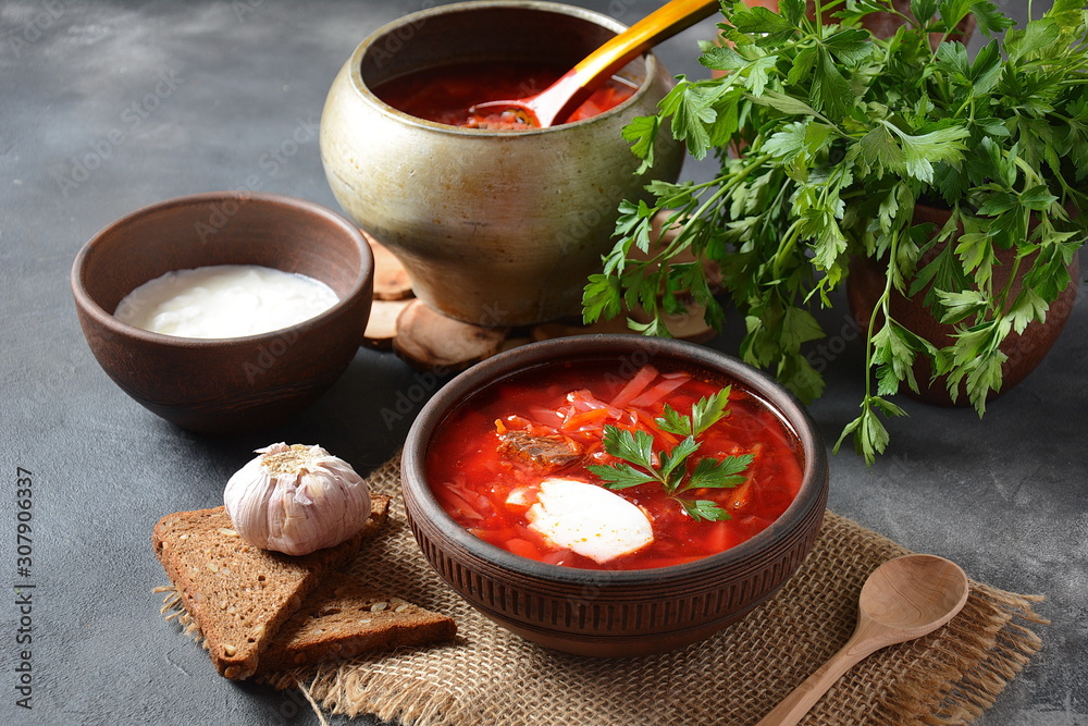 Traditional Ukrainian Russian borscht . Bowl of red beet root soup borsch with white cream . Beet Root delicious soup . Traditional Ukrain food cuisine Traditional Ukrainian Russian borscht . Bowl of red beet root soup borsch with white cream . Beet Root delicious soup . Traditional Ukrain food cuisine