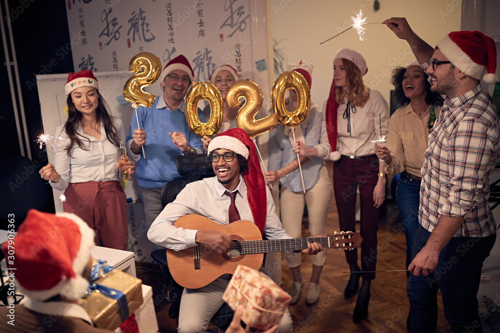 Fototapeta premium Business team celebrating new 2020 year in office