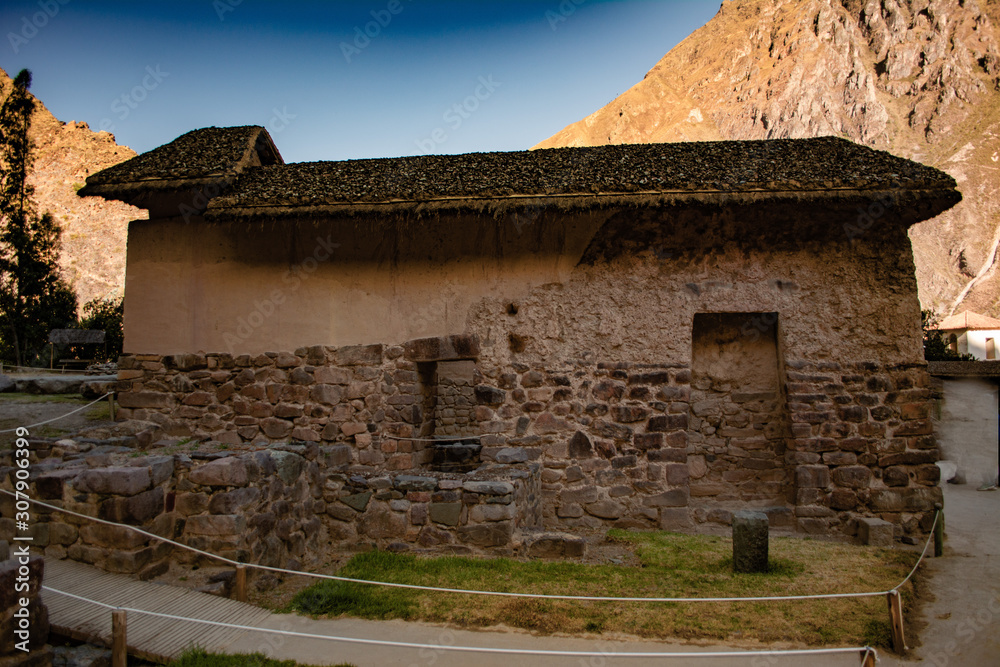 Inca old house of adobe and stone with mountain bottom in Ollantaytambo - Cusco.