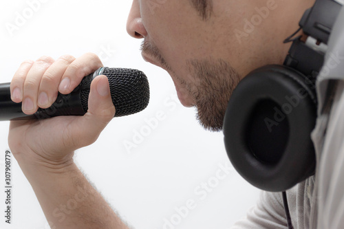 Man with microphone on white background © Ratchapon