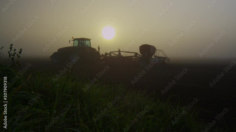 aerial view over the tractor in logs dawn aerial view over the tractor in logs dawn