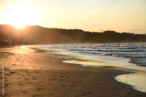 Beautiful Beach Sea and Sand at Sunset © FabriZiock