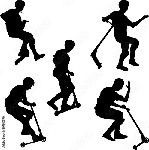 boy on scooters doing trick 