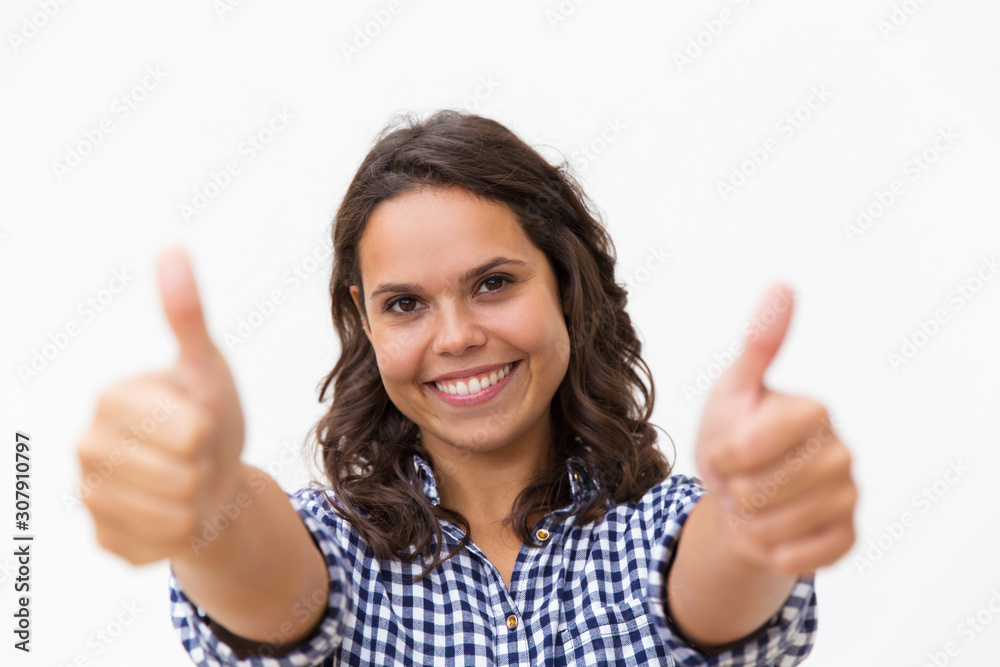 Satisfied female customer making Like gesture with both hands, looking at camera, smiling. Young woman in casual checked shirt standing isolated over white background. Customer rate concept Satisfied female customer making Like gesture with both hands, looking at camera, smiling. Young woman in casual checked shirt standing isolated over white background. Customer rate concept