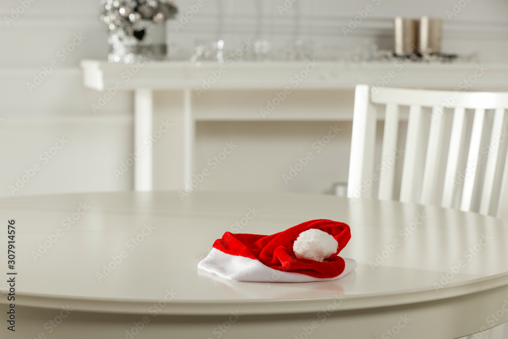 Fototapeta premium White wooden table of free space for your decoration.Christmas time and fireplace.Copy space. 