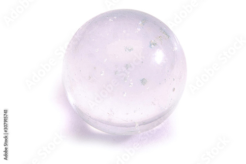 transparent glass sphere with inclusions on a white background