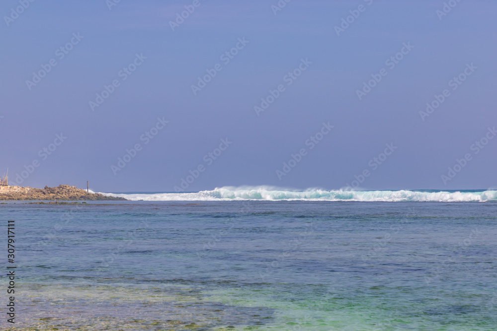 Big ocean waves and strong wind at Melasti beach. Ungasan, South Kuta, Badung Regency, Bali