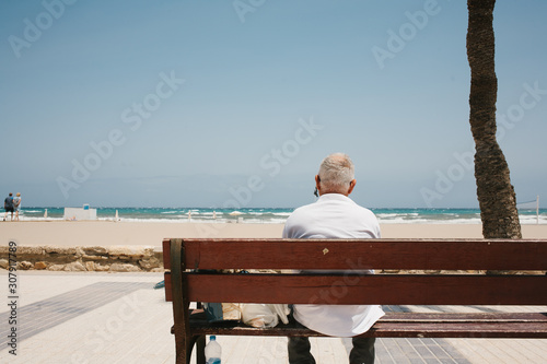 old man on spain beach