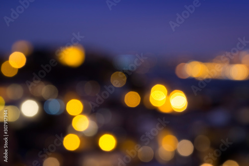 Blurred bokeh city lights, abstract night scene. High resolution full frame background.