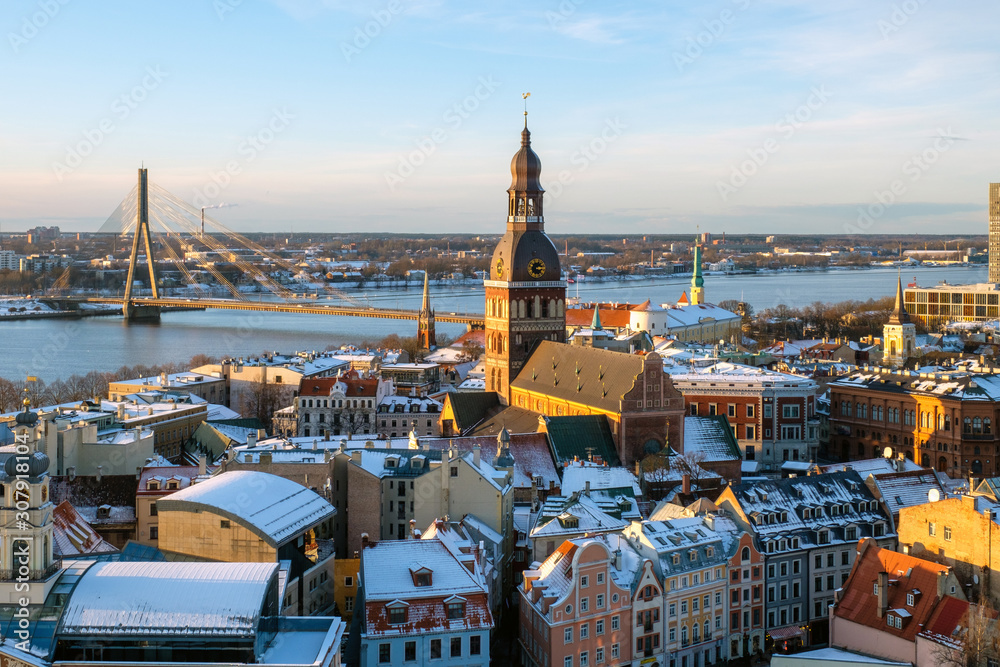 Fototapeta premium Panorama view from Riga cathedral on old town of Riga, Latvia. Aerial view on Riga city centre in sunny winter day.