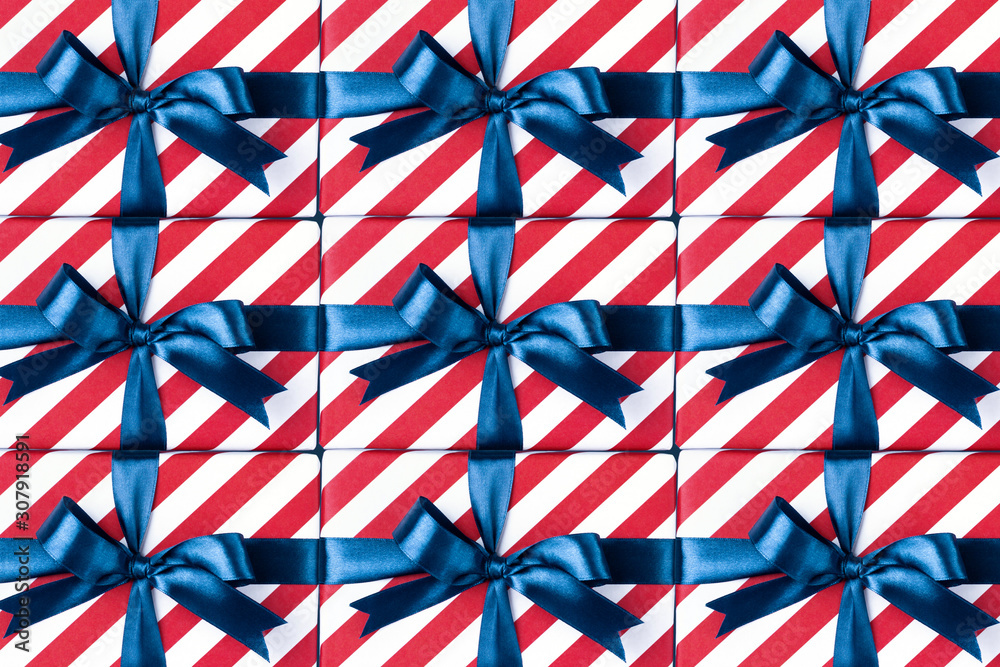 Many gift boxes with blue bows.