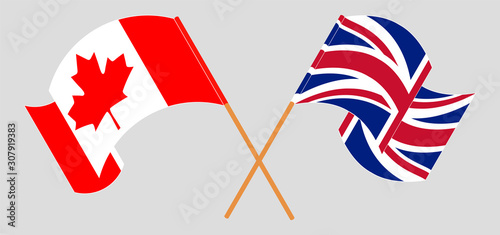 Crossed and waving flags of Canada and the UK