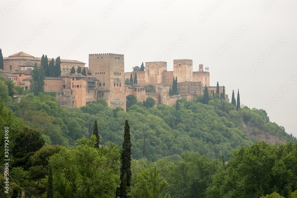 View to Alhambra form Sacromonte village famous for its houses made in caves at the hill slopes, Granada, Spain