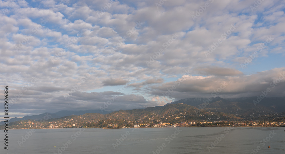 Panoramic view of the mountains and the sea in the city of Batumi. Georgia at sunset