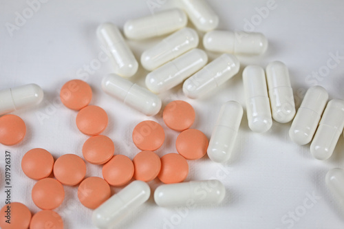 pills, vitamins or dietary supplements on a white background