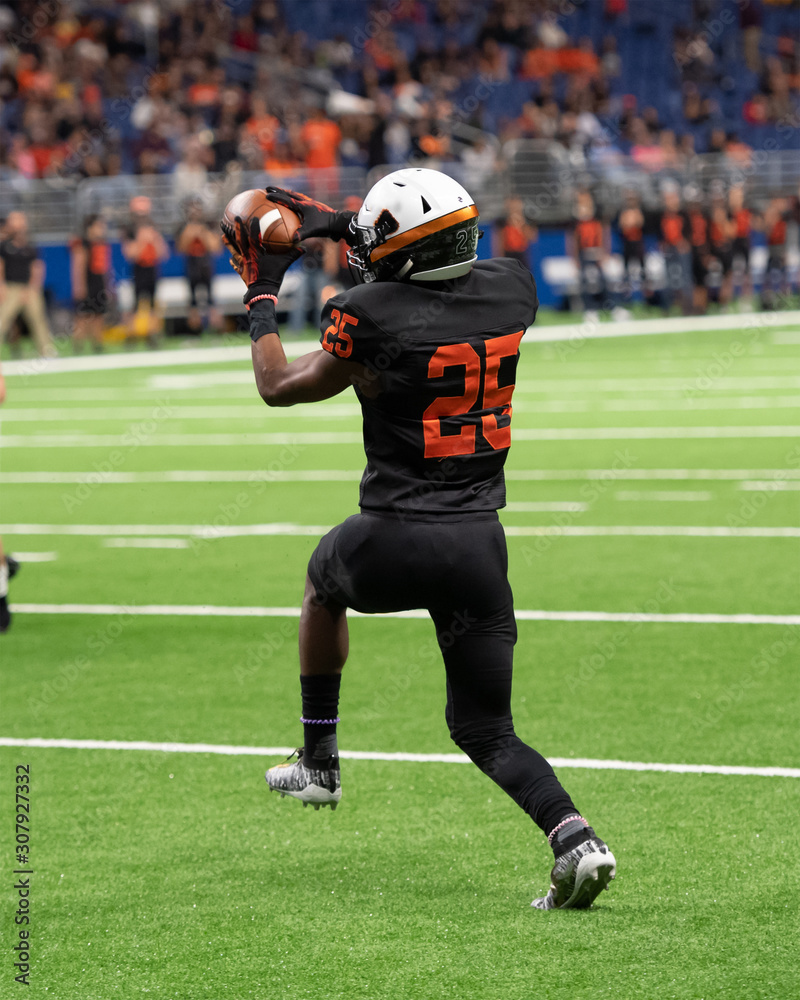 Football player in action during a game in South Texas