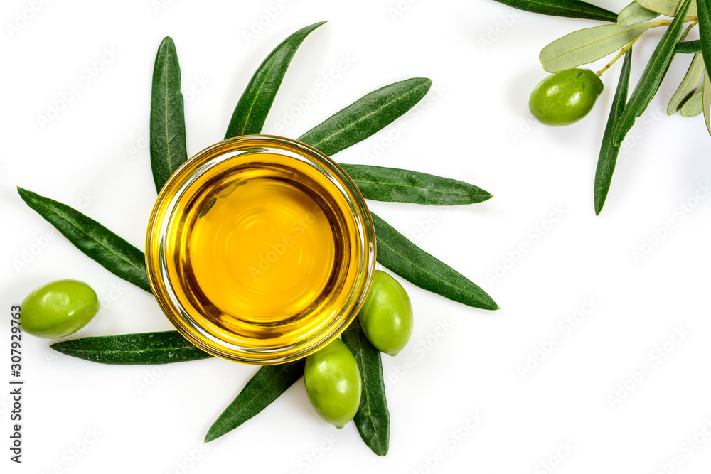 Olive oil. Greek olive oil in glass transparent bowl with branches with