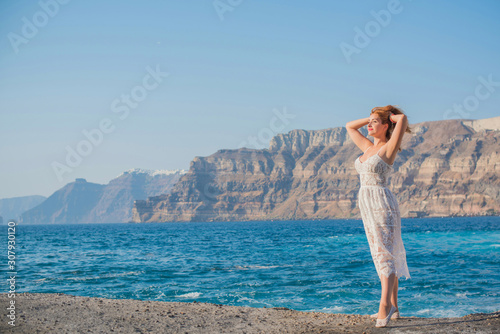 Nice plus size European or American woman rest in Santorini, vacation in Greece