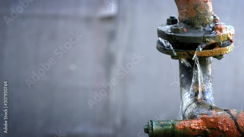 Water leaking from old rusty water supply pipe