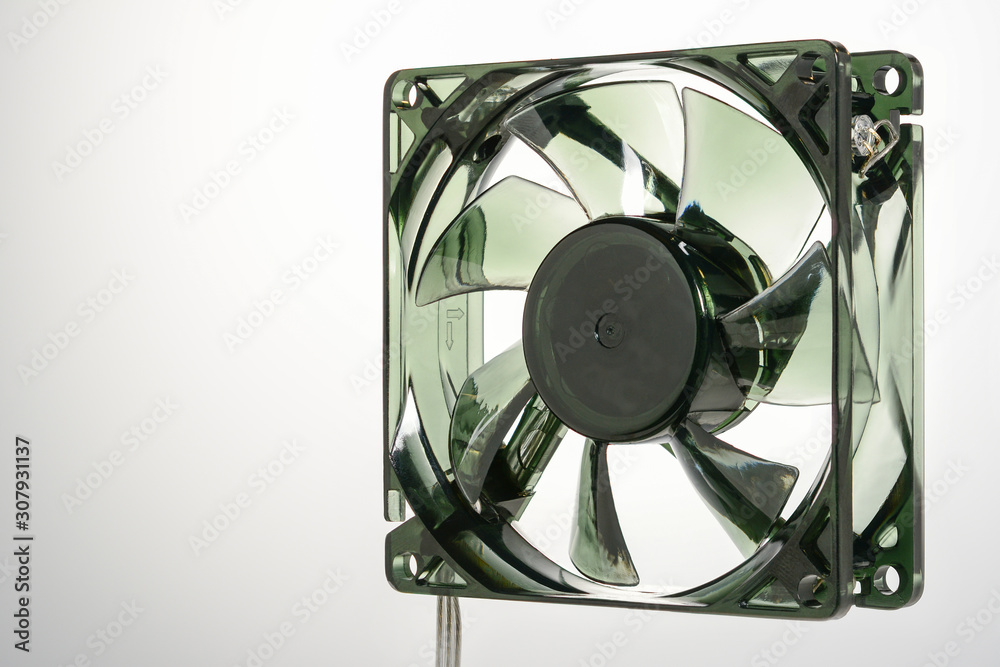 Translucent computer fan. Right side view of semitransparent pc cooler on grey gradient background, high resolution.
