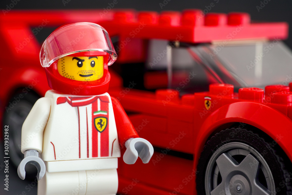 Ferrari F40 Competizione driver minifigure near his car by LEGO Speed Champions. Stock Photo | Adobe Stock