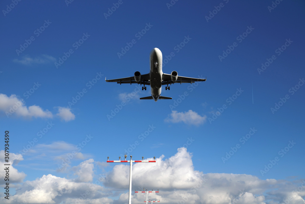 Aircraft warning lights and airplane before landing - Stockphoto