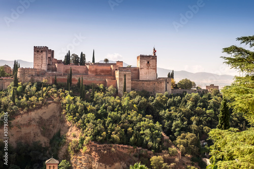 Ancient arabic fortress of Alhambra with Comares Tower, Palacios Nazaries and Palace of Charles, Granada, Spain photo