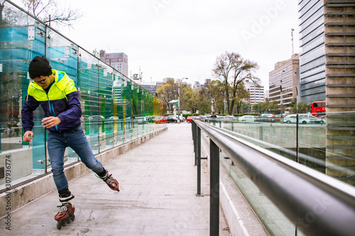 Young skater man skating trough the city