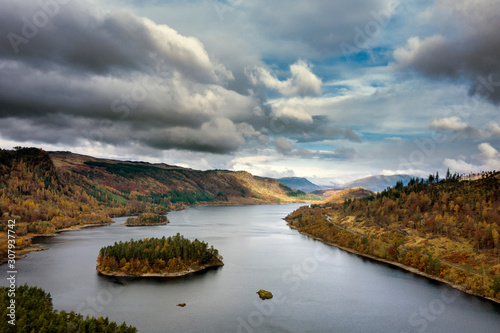 Stunning aerial drone landscape image of glorious vibrant Autumn Fall sun over Thirlmere in Lake District photo