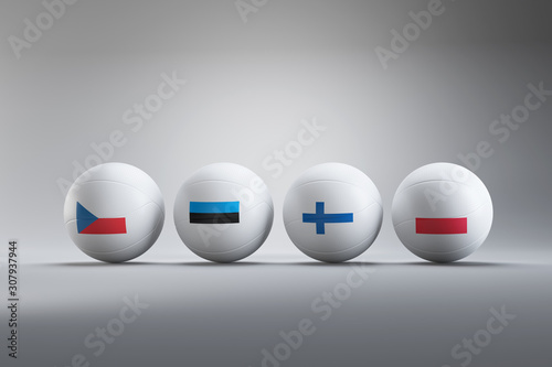 Valleyball European Championships in 2021, Czech Republic, Estonia, Finland and Poland will host and organize the tournament. Four balls coloured same as the organizer flags laying in white studio. photo