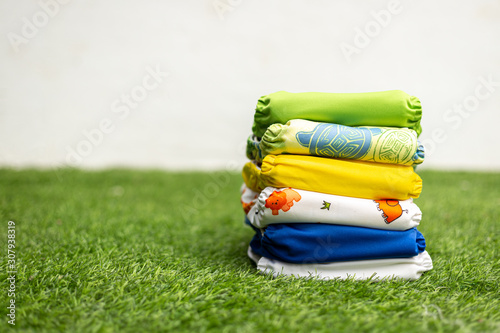 Stack of colorful cloth diapers for baby