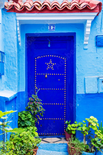 Traditional oriental doors with ornament in Morocco. © lizavetta