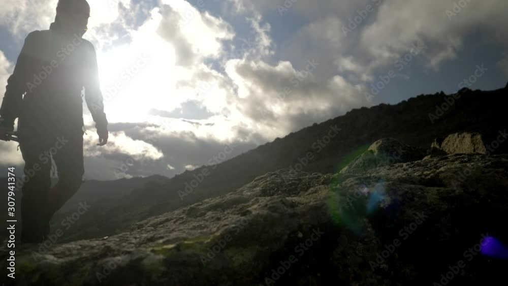 Young couple hiking in mountains in summer. Aurhentic video of people travel trekking with backpacks. Summer activity, active lifestyle. Family vacation, explore and discover concept. Young couple hiking in mountains in summer. Aurhentic video of people travel trekking with backpacks. Summer activity, active lifestyle. Family vacation, explore and discover concept.