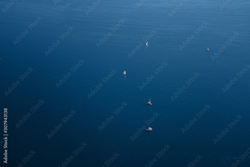 Blue sea surface with yachts. Landscape. Classic Blue color 2020.