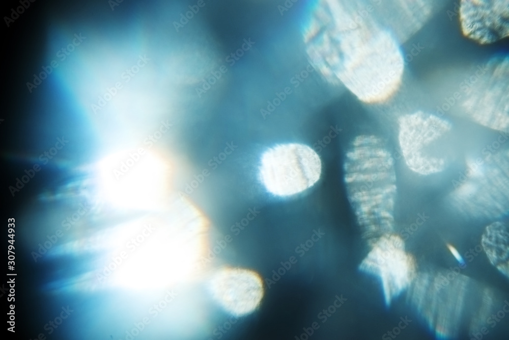 Obraz premium Easy to add overlay or screen filter over photos. Abstract sun burst. Digital lens flare background. Gleams rounded and hexagonal shapes, rainbow halo, iridescent glare.
