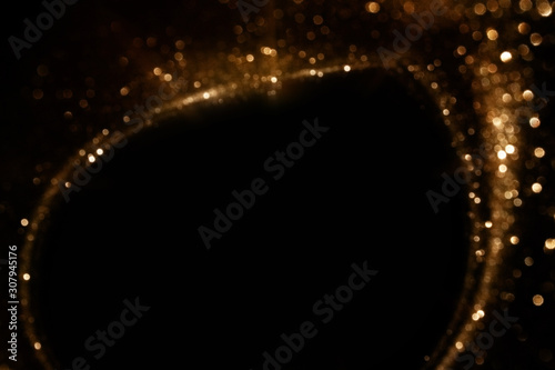 Easy to add lens flare effects for overlay designs or screen blending mode to make high-quality images. Abstract sun burst, digital flare, iridescent glare over black background. Free space for text.
