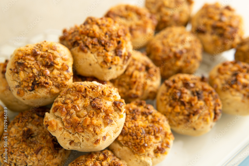 hazelnut and pecan cookies on white background