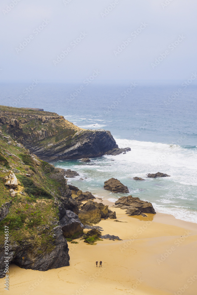 High angle view of two hikers hiking along the coast, Rota Vicentina, Portugal