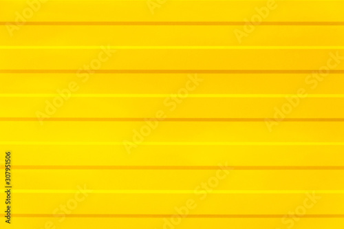 yellow texture. yellow fence with horizontal lines. yellow background. abstraction