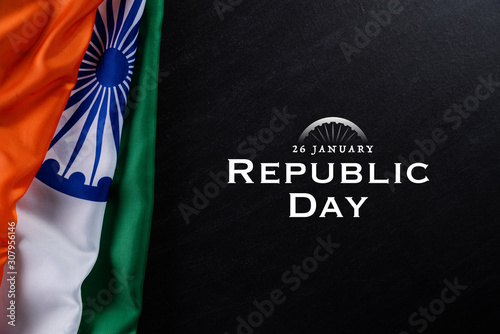 Indian republic day concept. Indian flag with the text Happy republic day against a blackboard background. 26 January.