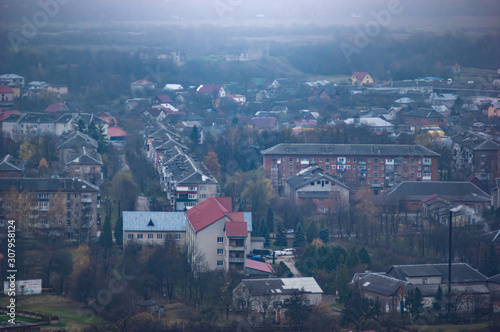 Houses in a city hazy in the autumn